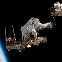 ESA astronaut Christer Fuglesang conducting a spacewalk during construction of the ISS.
