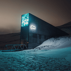 Svalbard Global Seed Vault, jutting out of the snow at night.