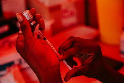 A doctor preparing a vaccine