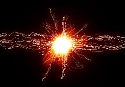A conceptual image showing a ball of yellow/orange energy in the center with lines of crackling energy shooting out of it.