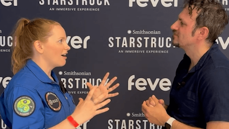 Reporter Alfredo Carpineti speaking with reserve astronaut Meganne Christian