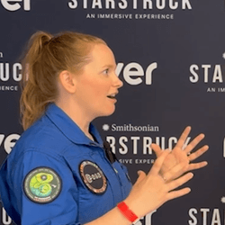 Reporter Alfredo Carpineti speaking with reserve astronaut Meganne Christian