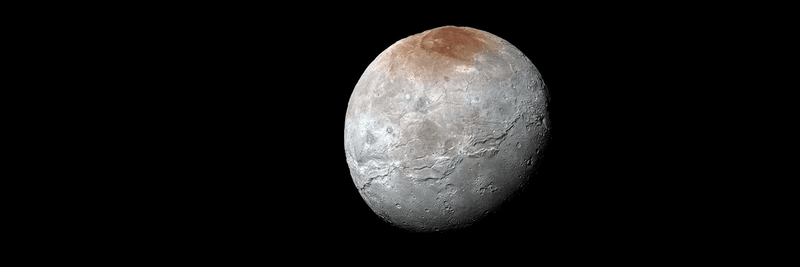 charon is a gray moon with wide ridges crossing its surface north to south. The north pole has a red region