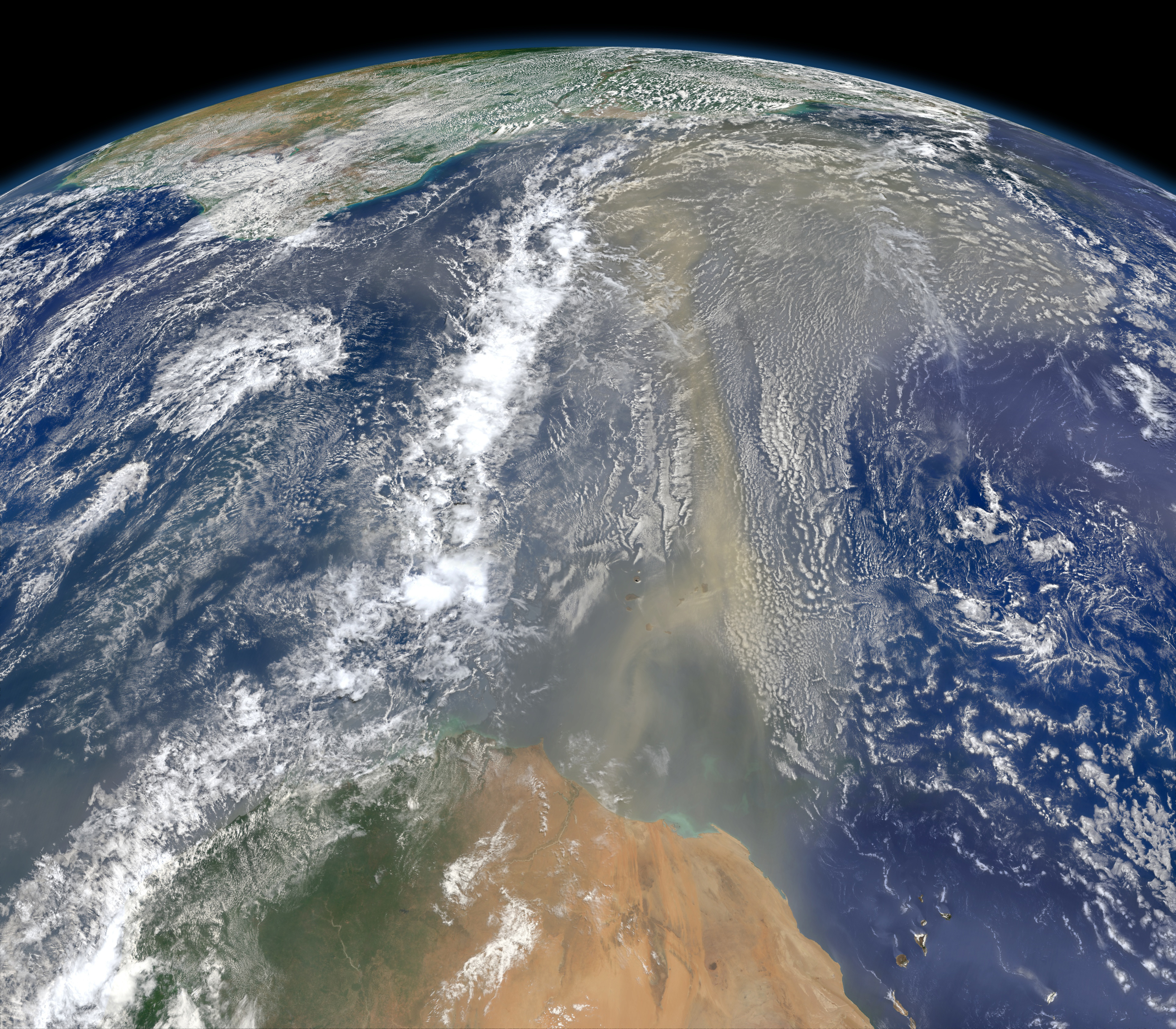 An image from space shows dust from the Sahara leaving West Africa, traversing over the Atlantic, toward the Americas. An image from space shows dust from the Sahara leaving West Africa, traversing over the Atlantic, toward the Americas.