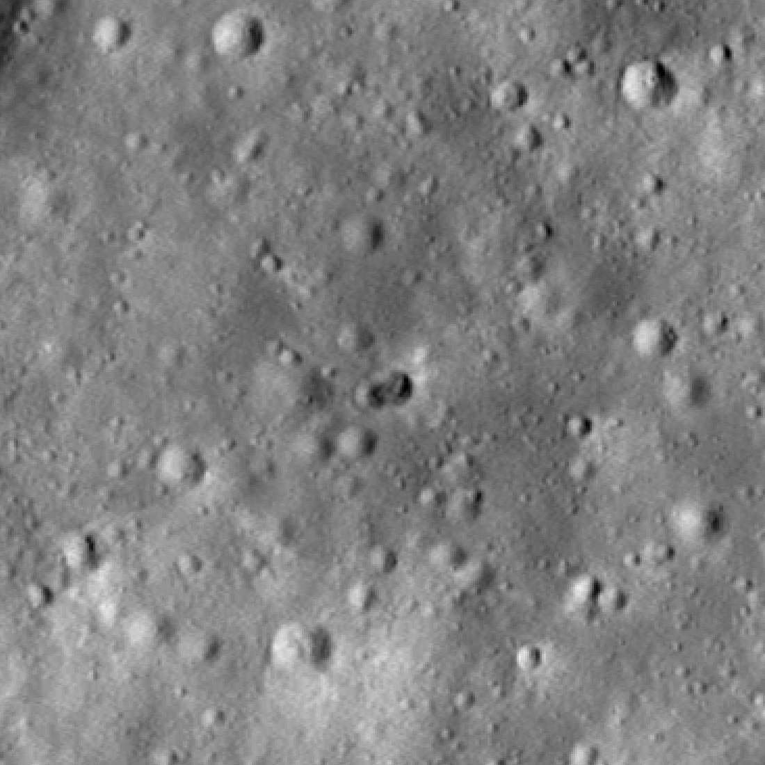 A gif that shows the surface of the Moon without an impact crater and then the strange double-crater appears