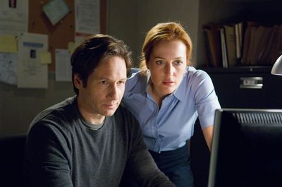 A still from the movie showing Mulder and Scully looking at a computer monitor