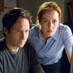 A still from the movie showing Mulder and Scully looking at a computer monitor