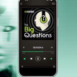 A picture of a man staring at a robot face, over laid with a mobile phone that has the big questions logo on it.