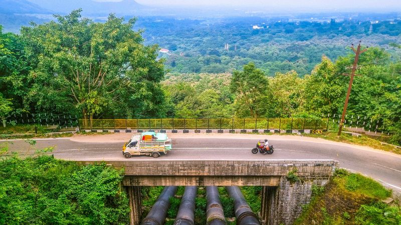 A bridge of diverted water from the Mullaperiyar Dam on the Kollam–Theni Highway in southern India.