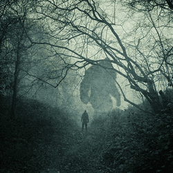 A silhouette of a giant at the end of a path through a forest (artwork).