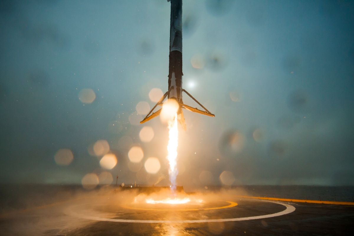 the first stage of a Falcon 9 rocket returns to Earth.