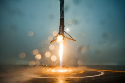 the first stage of a Falcon 9 rocket returns to Earth.