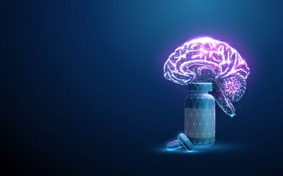 3D illustration of a human brain next to a bottle of pills in a glowing, digital style
