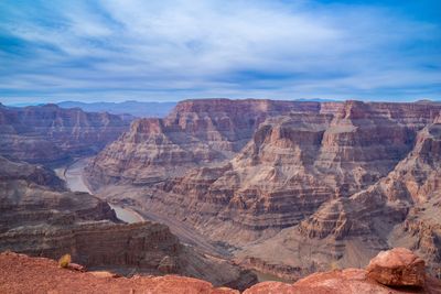 A view across the grand canyon showing its pinky-orange cliffs. 