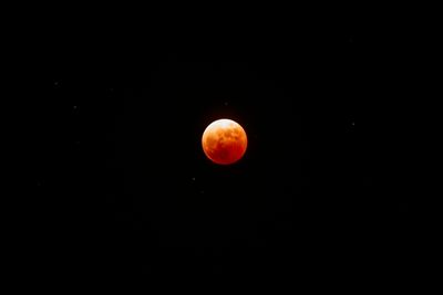 the moon almost completely red during an eclipse