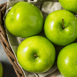 Granny smith apples, looking particularly green and crisp.
