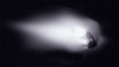 Halley's Comet, seen in the closest view humanity has ever had. It looks like a rock protruding from a cloud.