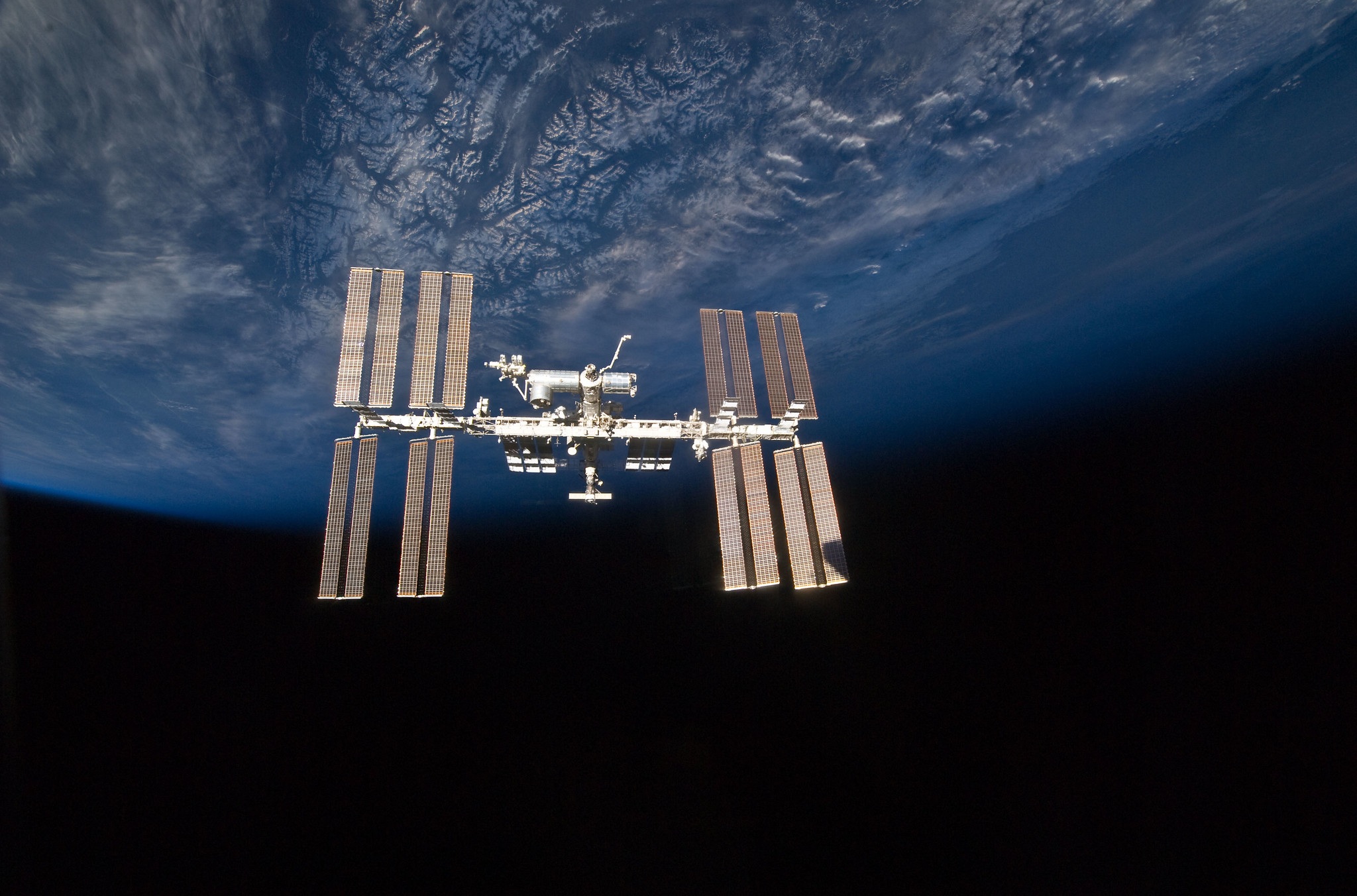 A picture of the ISS with the earth in the background. 