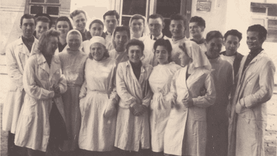 Medical staff at a hospital, in an old black and white photograph.