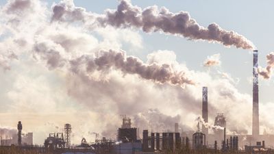 a coal power plant emitting a lot of smoke