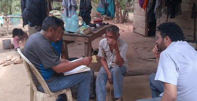 Tsimane Health and Life History Project investigators interview a participant in Bolivia.