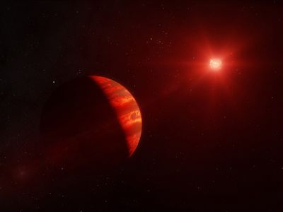a gas giant planet is illuminated by the red light of a red dwarf