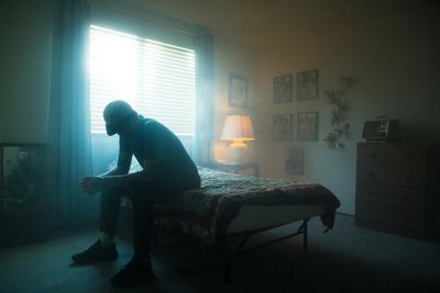 Lonely man in a room with silhouette