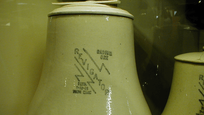An antique jug labeled "Revigator".
