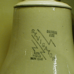 An antique jug labeled "Revigator".