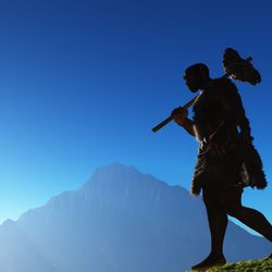 Ancient people against the evening landscape.