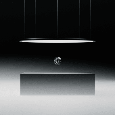 concept art showing a ball-bearing suspended between a cuboid and a flat disk with a glowing white underside