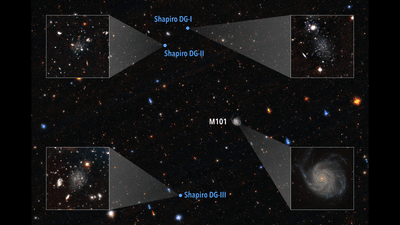 a full view of the area of the sky with four inset one showing the beautiful spiral that is the pinwheel. the other three showing some amorphous pale concentrations of stars